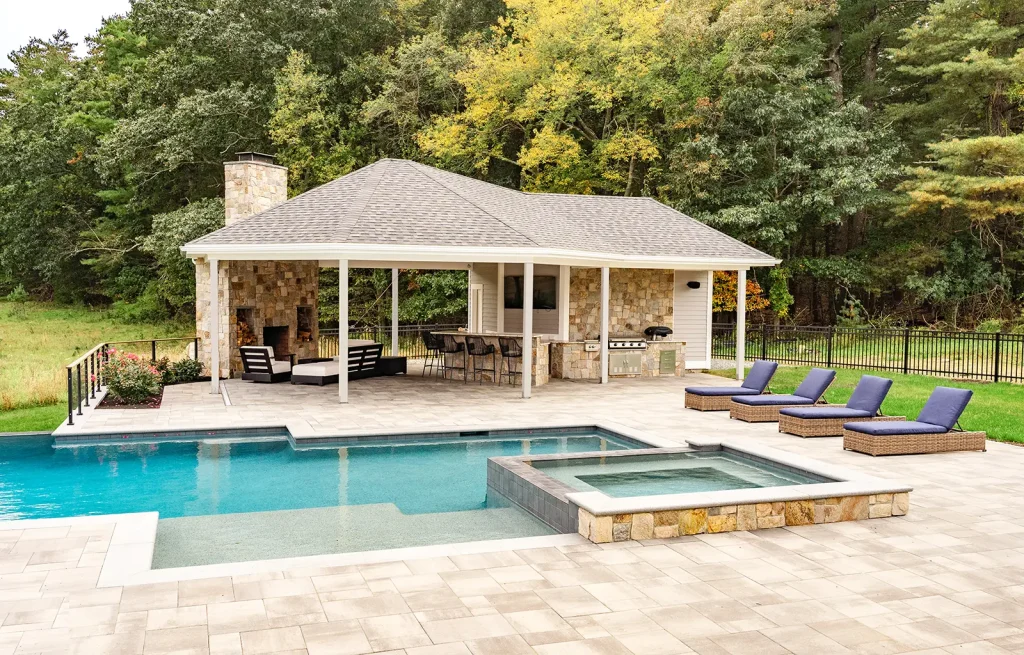 gazebo with a grill by a pool